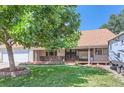 Ranch-style home with covered porch, mature trees, and RV parking at 10021 Miller St, Broomfield, CO 80021