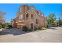 Three-story townhome with a two-car garage and landscaping at 10515 Ashfield St # 1D, Littleton, CO 80126