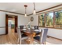 Bright dining room with hardwood floors and a view of the backyard at 6050 Belmont Way, Parker, CO 80134