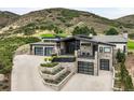 Modern house with stone exterior and mountain views at 7833 Galileo Way, Littleton, CO 80125