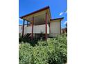 Elevated back deck with stairs and covered patio area at 2125 S Telluride Ct, Aurora, CO 80013
