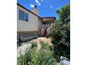 Backyard with patio, stairs, and landscaping at 2125 S Telluride Ct, Aurora, CO 80013