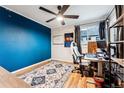 Bright bedroom with wood floors and a workspace at 1710 Sunlight Dr, Longmont, CO 80504