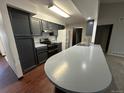Kitchen features dark grey cabinets and a large island at 2084 S Rifle St, Aurora, CO 80013