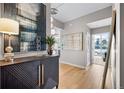 Modern entryway with hardwood floors, artwork, and stylish console table at 1700 Bassett St # 1901, Denver, CO 80202