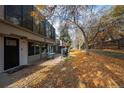 Pathway leading to townhome with autumn leaves and landscaping at 2362 S Troy St, Aurora, CO 80014