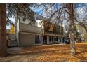 Back exterior of townhome with private patio and mature trees at 2362 S Troy St, Aurora, CO 80014