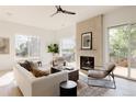 Spacious living room featuring a fireplace and large windows at 16113 W 14Th Ave, Golden, CO 80401