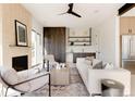 Bright living room with fireplace and access to deck at 16113 W 14Th Ave, Golden, CO 80401