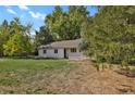 Rear view of a ranch style home with yard at 577 96Th St, Louisville, CO 80027