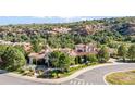 Luxury estate home with terracotta roof, set on a hill overlooking mountains at 7944 Dante Dr, Littleton, CO 80125