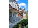 Gray exterior with red accents and landscaping at 2855 Rock Creek Cir # 191, Superior, CO 80027