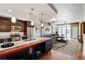 Modern kitchen with stainless steel appliances and large island at 2001 Lincoln St # 1024, Denver, CO 80202