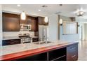 Modern kitchen with stainless steel appliances and large island at 2001 Lincoln St # 1024, Denver, CO 80202