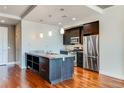 Modern kitchen with stainless steel appliances and large island at 2001 Lincoln St # 1024, Denver, CO 80202