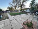 Large backyard with patio and walkway at 639 Strong St, Brighton, CO 80601