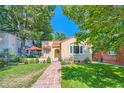 Charming bungalow style home with a stone walkway at 1650 Eudora St, Denver, CO 80220