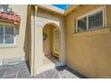 Inviting front entry with arched doorway and wreath at 1650 Eudora St, Denver, CO 80220