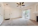 Living room with carpet, fireplace, and sliding glass door at 8200 E 8Th Ave # 7103, Denver, CO 80230