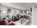 Open living room and kitchen with modern decor at 3040 W 66Th Ave, Denver, CO 80221