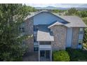 Exterior view of building, landscaping, and mountain at 8065 W Eastman Pl # 6-303, Denver, CO 80227