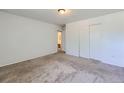 Spacious bedroom with neutral carpeting and a large closet at 2565 S Sheridan Blvd # 20, Denver, CO 80227