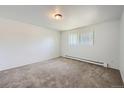 Bright bedroom with neutral carpeting and a window at 2565 S Sheridan Blvd # 20, Denver, CO 80227
