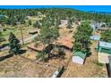 Aerial view of a home with detached garage and large lot at 801 Panorama Dr, Golden, CO 80401