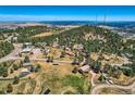 Aerial view showcasing a mountain community with surrounding landscape at 801 Panorama Dr, Golden, CO 80401