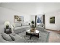 Virtually staged living room with neutral colors and modern furniture at 444 Highland Dr, Longmont, CO 80504