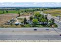Aerial view of property, showing its large lot size and surroundings at 11960 Quebec St, Brighton, CO 80602