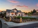 Beautiful home with a three-car garage, gated entrance, and lovely landscaping at 6531 S Harlan Ct, Littleton, CO 80123