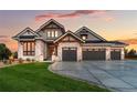 Luxury home with stone facade and three-car garage at 6531 S Harlan Ct, Littleton, CO 80123