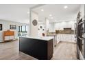 Open concept kitchen with granite countertops and island at 3131 E Alameda Ave # 1107, Denver, CO 80209