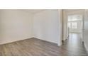 Bright hallway with wood-look flooring at 245 S Vandriver Way, Aurora, CO 80018