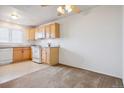 Kitchen and dining area with carpet flooring at 2715 W 86Th Ave # 21, Westminster, CO 80031