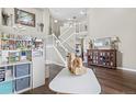 Two-story entryway with hardwood floors, staircase, and ample natural light at 500 Hampstead Ave, Castle Rock, CO 80104