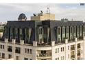 Exclusive rooftop view with arched windows and a terrace at 925 N Lincoln St # 14C, Denver, CO 80203