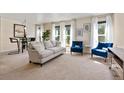 Spacious living room with comfy seating and large windows at 1150 Inca St # 27, Denver, CO 80204