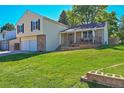 Two-story house with attached garage and large backyard at 5927 S Kline St, Littleton, CO 80127