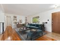 Living room with hardwood floors and staged furniture at 7886 Cyd Dr, Denver, CO 80221