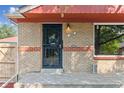 Front entrance with decorative security door at 7886 Cyd Dr, Denver, CO 80221