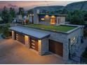 Modern home with a green roof and three car garage at 5123 Quaker St, Golden, CO 80403