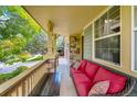 Inviting front porch with wicker furniture and a wooden table at 159 N Prairie Falcon Pkwy, Brighton, CO 80601