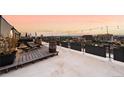 Private rooftop deck with city views and lounge chairs at 669 N Washington St # 901, Denver, CO 80203