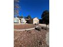Ranch-style house with attached garage and landscaping at 18269 E Hampden Pl, Aurora, CO 80013