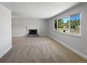 Living room with fireplace and large window at 9475 Lowell Blvd, Westminster, CO 80031