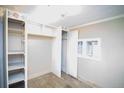 Empty bedroom with wood floors and built-in shelving at 4263 S Elati St, Englewood, CO 80110