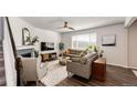 Living room featuring fireplace and seating area at 25026 E Bayaud Pl, Aurora, CO 80018