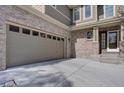 Attached garage with ample parking space and exterior access at 2599 S Jebel Way, Aurora, CO 80013